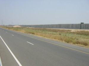 An old picture of the separation fence along Highway 6.