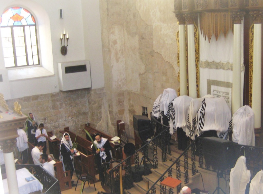 Note the Cohens covered with their tallits in front of the Torah.