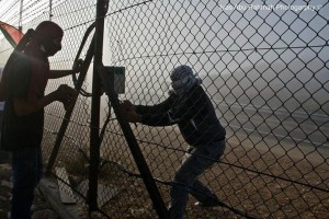 Here were terrorist breaking through the fence along Road 443 yesterday (Picture source on picture).