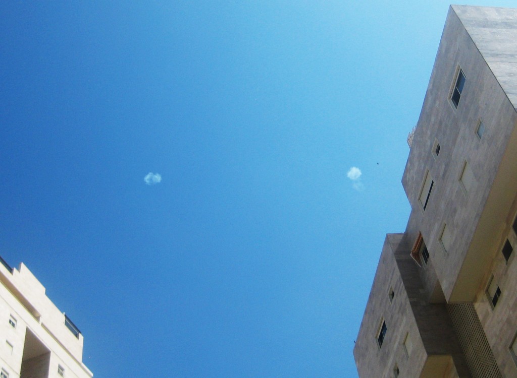 Overhead at the ATM machine yesterday: the distinctive puffs of the Iron Dome intercepts.