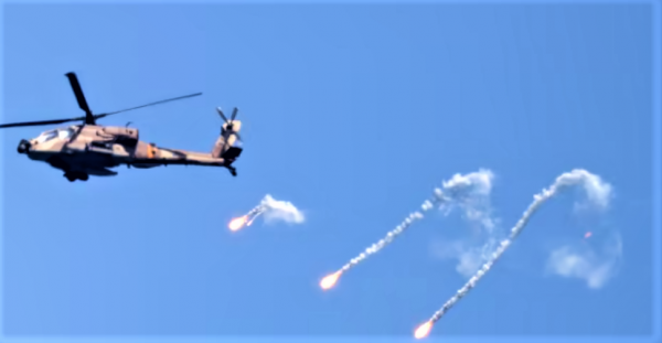 Attack helicopters have been heavily used by the IAF in this mini-war. Here is a photo from yesterday of a helicopter dropping burning flares to deflect any ground fire (photo: Walla)..