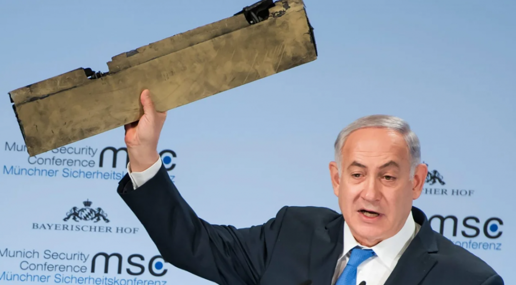 Former PM Netanyahu holding up a piece of an Iranian drone shot down over Israel. This photo was made at a security conference in Munich in 2018.