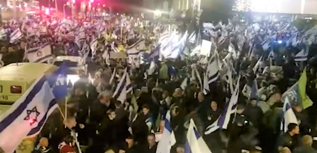 Some of the 100,000 pro-government supporters in Tel Aviv last night.