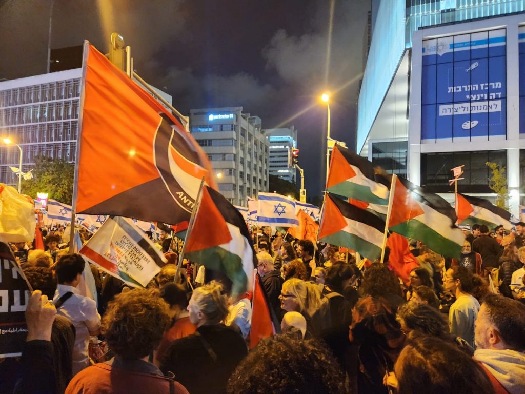Note the large Antifa flag to the left and the PLO flags (photo Moti Kastel).