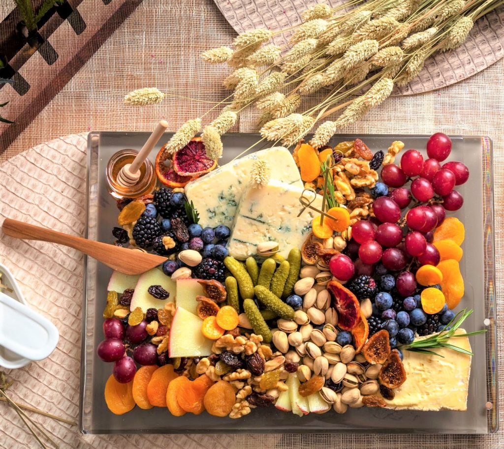 A typical Israeli cheese tray with fruits, nuts, and grains of all types.