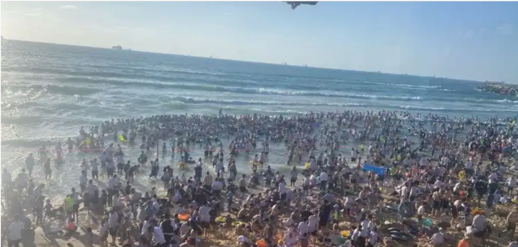 The scene a few hours ago here in Ashdod--just down the street from your humble servant's home. The beach is one designated for the orthodox.