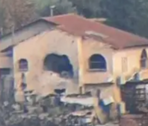 The home in Moshav Yuval that was hit by the anti-tank missile (note the hole in the side).